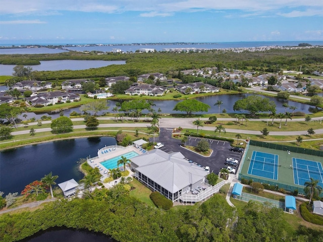 drone / aerial view with a water view and a residential view
