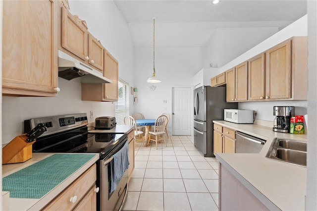 4610 Runabout Way, Bradenton, FL 34203 - kitchen featuring appliances with stainless steel finishes, under cabinet range hood, a sink, light brown cabinetry, and high vaulted ceiling