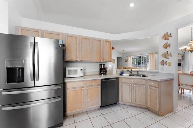 4610 Runabout Way, Bradenton, FL 34203 - kitchen with stainless steel refrigerator with ice dispenser, dishwasher, white microwave, a sink, and light brown cabinets
