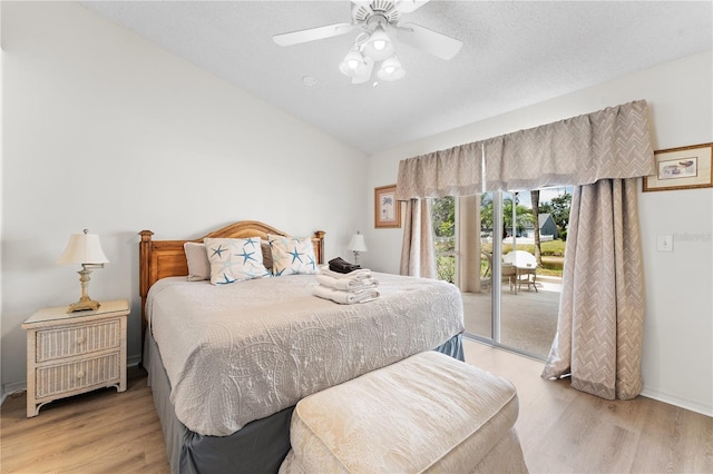 4610 Runabout Way, Bradenton, FL 34203 - bedroom featuring access to outside, light wood-style flooring, vaulted ceiling, a ceiling fan, and baseboards