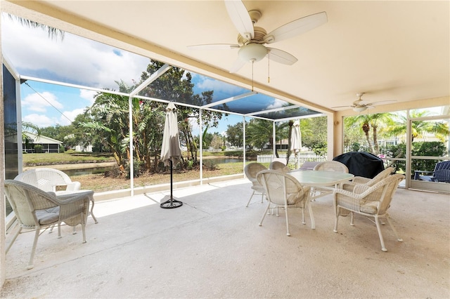 4610 Runabout Way, Bradenton, FL 34203 - view of patio / terrace featuring a ceiling fan, a water view, outdoor dining space, a lanai, and grilling area