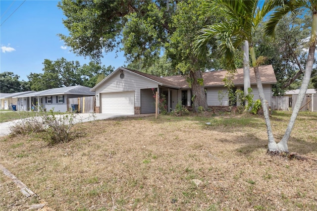 920 36th St W, Bradenton, FL 34205 - ranch-style house with a garage, brick siding, and driveway