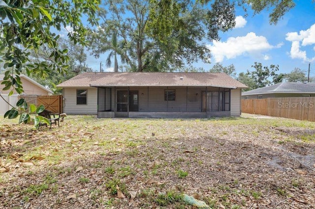 920 36th St W, Bradenton, FL 34205 - rear view of property featuring a sunroom