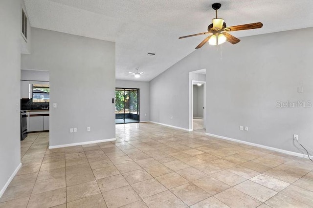 920 36th St W, Bradenton, FL 34205 - empty room featuring a ceiling fan, light tile patterned flooring, lofted ceiling, baseboards, and a textured ceiling