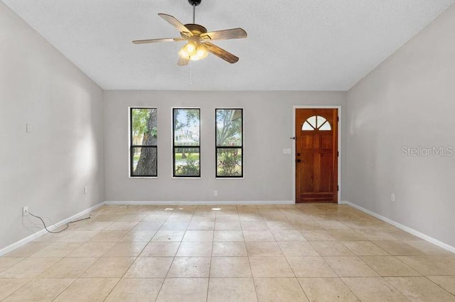 920 36th St W, Bradenton, FL 34205 - foyer featuring a ceiling fan, baseboards, and light tile patterned flooring
