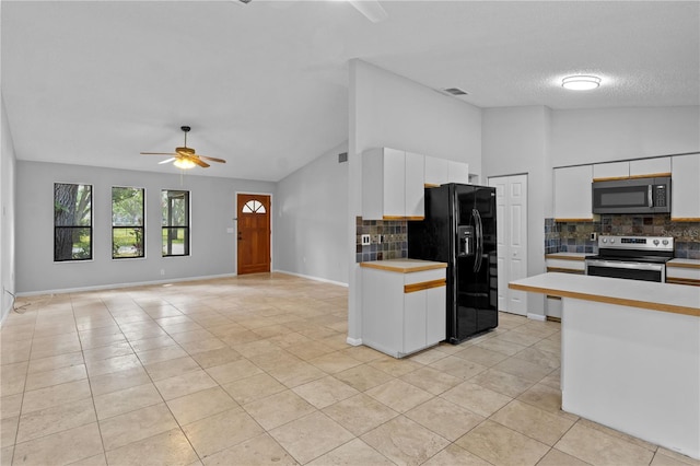 920 36th St W, Bradenton, FL 34205 - kitchen with stainless steel appliances, lofted ceiling, backsplash, ceiling fan, and light countertops