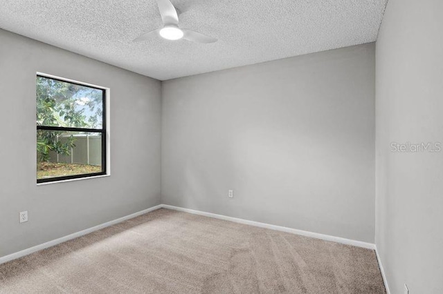 920 36th St W, Bradenton, FL 34205 - unfurnished room with ceiling fan, carpet flooring, a textured ceiling, and baseboards