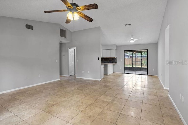 920 36th St W, Bradenton, FL 34205 - unfurnished living room featuring ceiling fan, light tile patterned floors, baseboards, and lofted ceiling