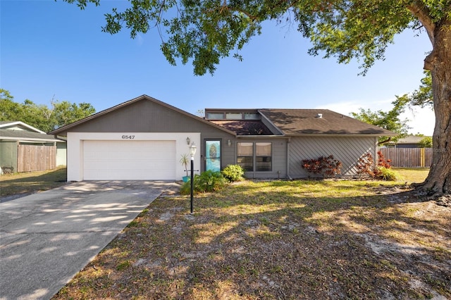 6547 Samoa Dr, Sarasota, FL 34241 - view of front facade featuring a garage and concrete driveway