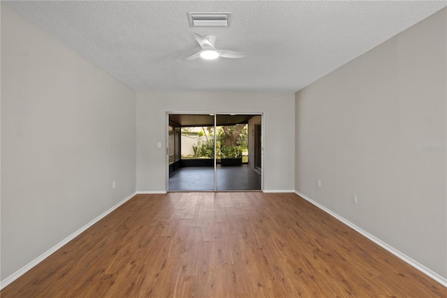 3505 27th Ave W, Bradenton, FL 34205 - spare room with ceiling fan, baseboards, wood finished floors, and a textured ceiling