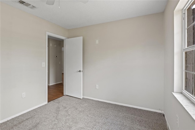 3505 27th Ave W, Bradenton, FL 34205 - carpeted spare room featuring baseboards and a ceiling fan