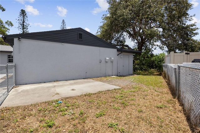 3505 27th Ave W, Bradenton, FL 34205 - back of house with a fenced backyard, stucco siding, and a patio area
