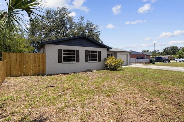 3505 27th Ave W, Bradenton, FL 34205 - view of front of house featuring driveway, a garage, and stucco siding