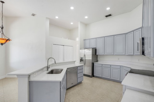 1125 English Garden Ln, Winter Garden, FL 34787 - kitchen featuring gray cabinetry, visible vents, stainless steel appliances, and a sink