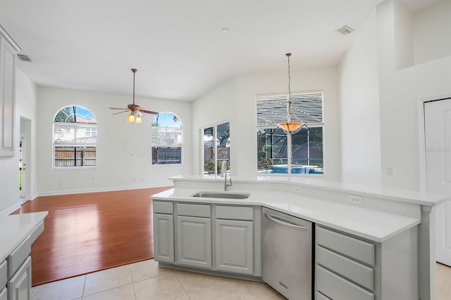 1125 English Garden Ln, Winter Garden, FL 34787 - kitchen with light countertops, dishwasher, visible vents, a sink, and ceiling fan
