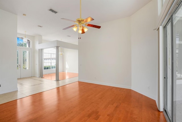 1125 English Garden Ln, Winter Garden, FL 34787 - interior space with a high ceiling, a ceiling fan, visible vents, and light wood-style flooring