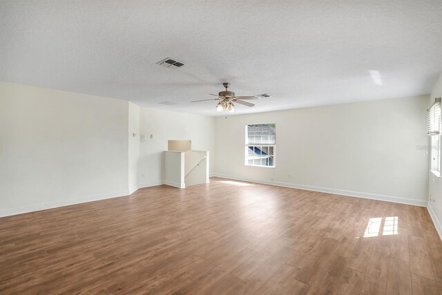 1125 English Garden Ln, Winter Garden, FL 34787 - spare room with ceiling fan, wood finished floors, visible vents, and a textured ceiling