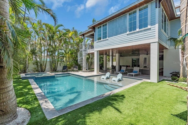 222 Willow Ave, Anna Maria, FL 34216 - rear view of property featuring a ceiling fan, a yard, a patio, outdoor lounge area, and stairs