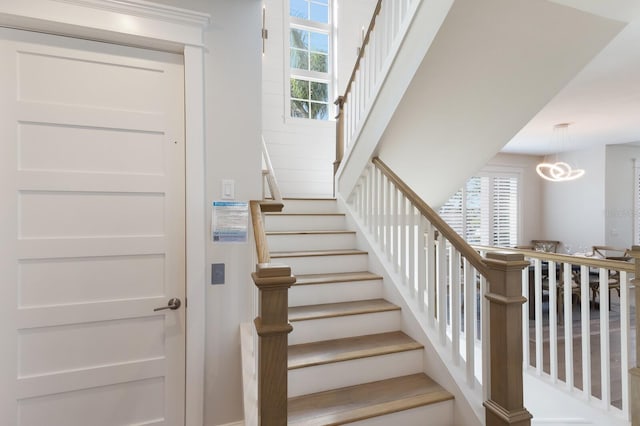 222 Willow Ave, Anna Maria, FL 34216 - stairs with a notable chandelier