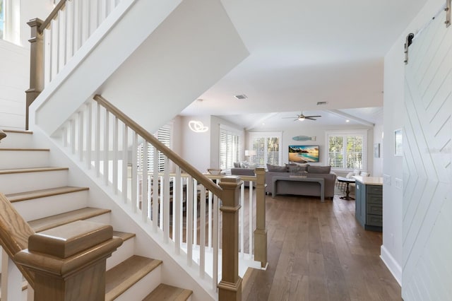 222 Willow Ave, Anna Maria, FL 34216 - staircase featuring ceiling fan, hardwood / wood-style flooring, a barn door, and visible vents