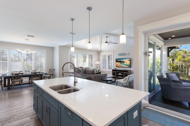 222 Willow Ave, Anna Maria, FL 34216 - kitchen featuring a sink, open floor plan, and light countertops