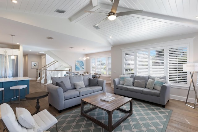 222 Willow Ave, Anna Maria, FL 34216 - living room with stairs, baseboards, vaulted ceiling with beams, wood finished floors, and visible vents