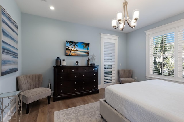 222 Willow Ave, Anna Maria, FL 34216 - bedroom featuring recessed lighting, wood finished floors, and a chandelier
