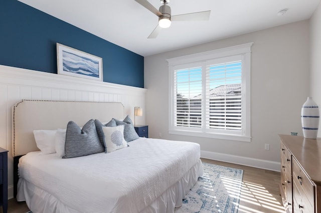 222 Willow Ave, Anna Maria, FL 34216 - bedroom featuring baseboards, ceiling fan, and light wood-type flooring