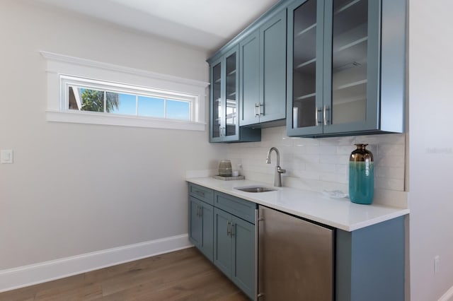 222 Willow Ave, Anna Maria, FL 34216 - bar featuring tasteful backsplash, a sink, baseboards, dark wood-style floors, and dishwashing machine