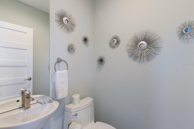 222 Willow Ave, Anna Maria, FL 34216 - half bathroom with a sink and toilet