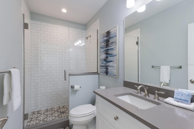 222 Willow Ave, Anna Maria, FL 34216 - bathroom featuring recessed lighting, vanity, a stall shower, and toilet