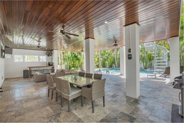222 Willow Ave, Anna Maria, FL 34216 - view of patio / terrace with ceiling fan, an outdoor pool, stairway, an outdoor hangout area, and outdoor dining space