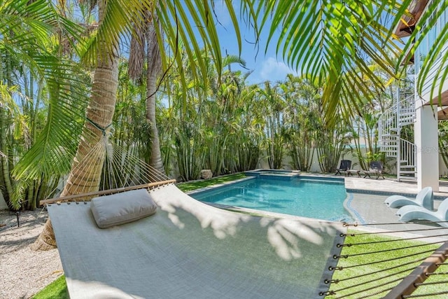 222 Willow Ave, Anna Maria, FL 34216 - view of swimming pool featuring a pool with connected hot tub, a patio area, and stairway