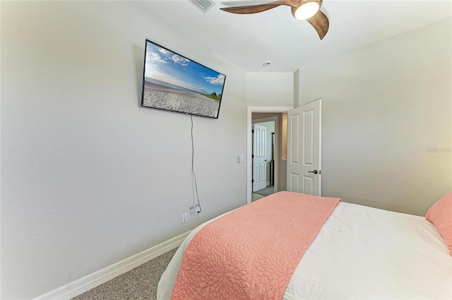 bedroom featuring baseboards, visible vents, ceiling fan, and carpet