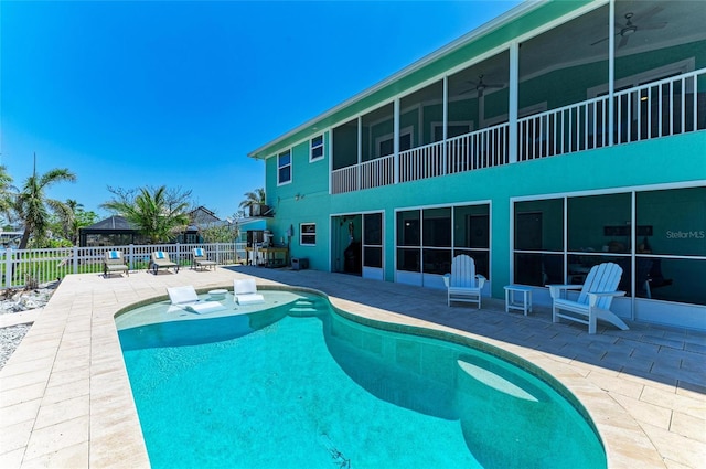 view of pool with a patio, a fenced in pool, a ceiling fan, and a fenced backyard