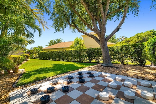 7804 Edmonston Cir, University Park, FL 34201 - view of community featuring a lawn and a patio area