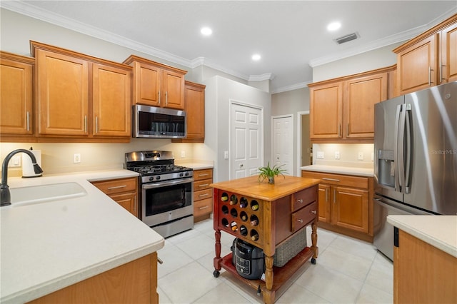 7804 Edmonston Cir, University Park, FL 34201 - kitchen featuring visible vents, ornamental molding, recessed lighting, a sink, and appliances with stainless steel finishes