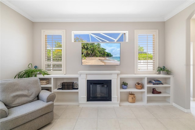 7804 Edmonston Cir, University Park, FL 34201 - living area with a healthy amount of sunlight, tile patterned floors, ornamental molding, and a glass covered fireplace