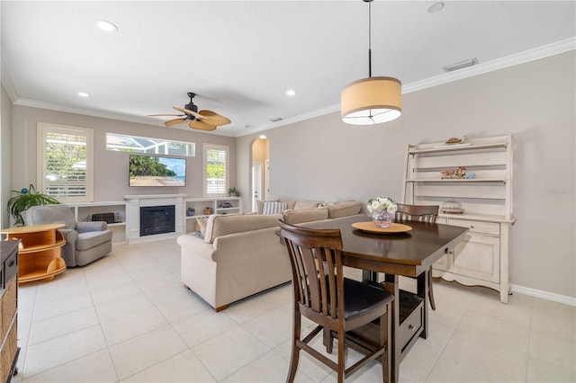 7804 Edmonston Cir, University Park, FL 34201 - dining space with arched walkways, plenty of natural light, and ornamental molding
