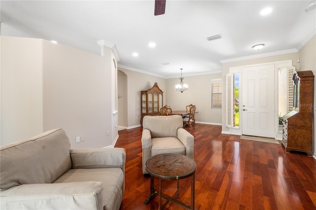 7804 Edmonston Cir, University Park, FL 34201 - living area with visible vents, crown molding, dark wood finished floors, baseboards, and a chandelier