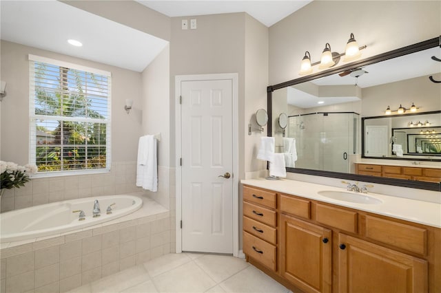 7804 Edmonston Cir, University Park, FL 34201 - bathroom with vanity, tile patterned floors, a shower stall, and a garden tub