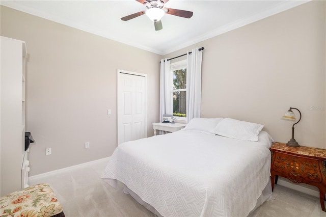 7804 Edmonston Cir, University Park, FL 34201 - bedroom featuring light colored carpet, a ceiling fan, baseboards, ornamental molding, and a closet