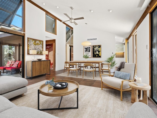 living room featuring plenty of natural light, a ceiling fan, recessed lighting, and high vaulted ceiling