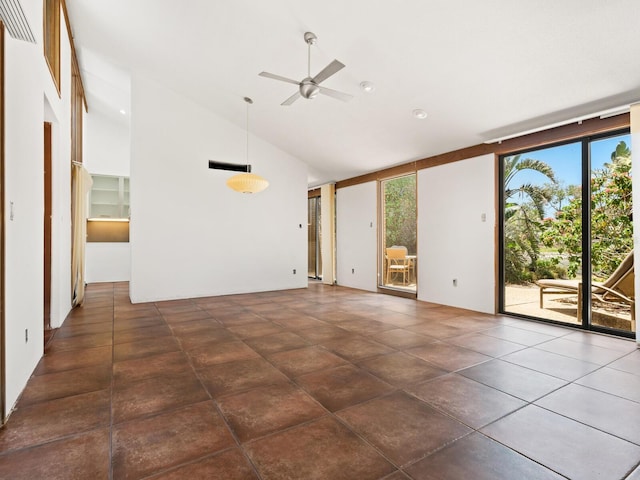 empty room with ceiling fan and high vaulted ceiling
