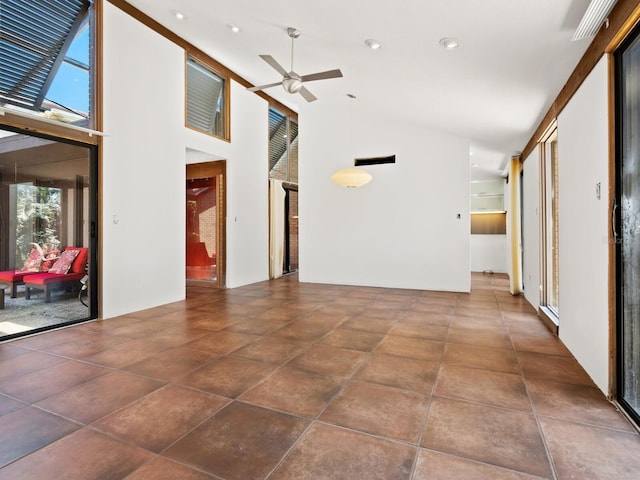 unfurnished living room featuring a ceiling fan, high vaulted ceiling, and recessed lighting