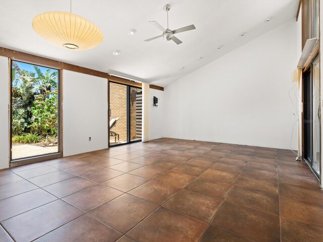 spare room featuring ceiling fan and lofted ceiling