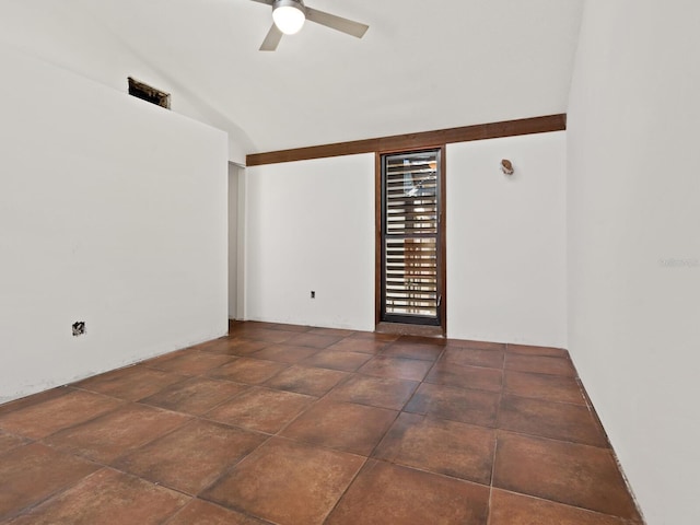 empty room with ceiling fan and lofted ceiling