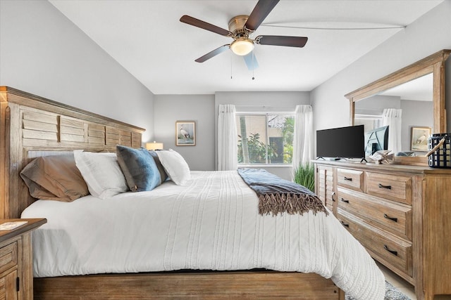 bedroom with a ceiling fan and wood finished floors