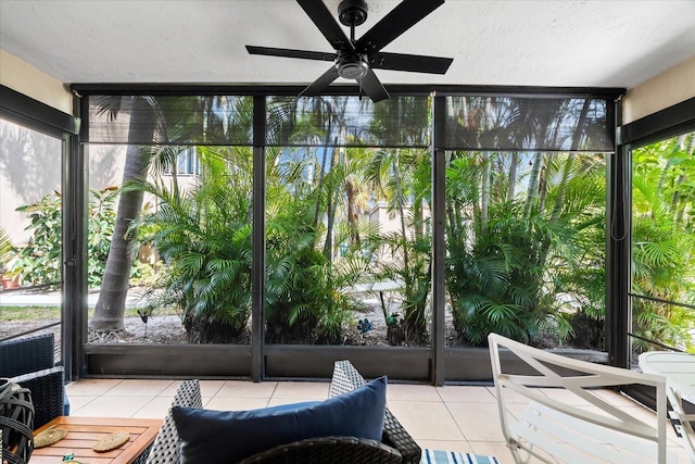 sunroom featuring a ceiling fan