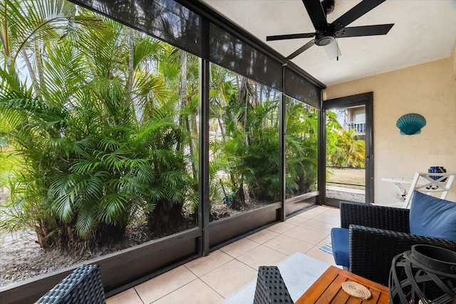 sunroom featuring ceiling fan
